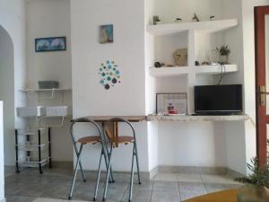 Televízia a/alebo spoločenská miestnosť v ubytovaní Apartments Desa