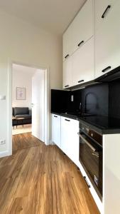 Kuchyň nebo kuchyňský kout v ubytování Short Way Apartments