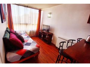 a living room with a couch and a table at Metroapart 3 in Santiago