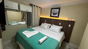 Rúm í herbergi á Solar de Pipa Vip Confort - Spa Hidro Flat +37 myndir