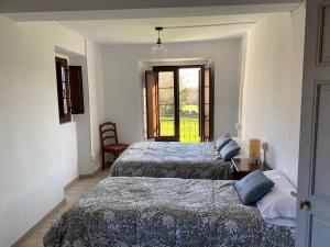 Ένα ή περισσότερα κρεβάτια σε δωμάτιο στο La Casa de Xuncu