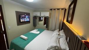 Rúm í herbergi á Solar de Pipa Vip Confort - Spa Hidro Flat
