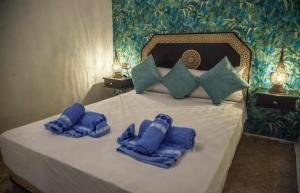 Postel nebo postele na pokoji v ubytování Riad bab merzouga