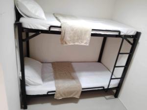 a couple of bunk beds in a room at Casa de Ligaya San Pablo in San Pablo