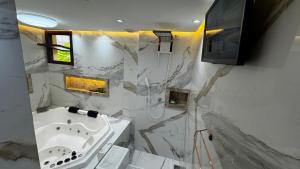 Baðherbergi á Solar de Pipa Vip Confort - Spa Hidro Flat