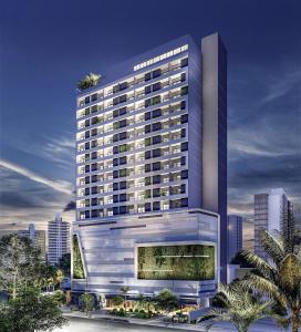 クイアバにあるStudio Cuiabá NOVO - Frente ao Shopping Estaçãoの椰子の木の高い建物の描写