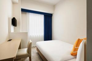Postel nebo postele na pokoji v ubytování Four Points Flex by Sheraton Morioka