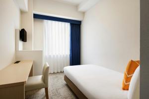 Postel nebo postele na pokoji v ubytování Four Points Flex by Sheraton Morioka