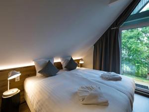 Ένα ή περισσότερα κρεβάτια σε δωμάτιο στο Exklusive Chalet in Buntenbock