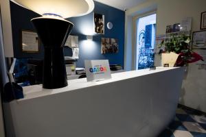 a store counter with a lamp on top of it at Alessi Hotel Trattoria in Desenzano del Garda