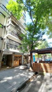 a building with a pavilion in front of a building at Apartamento moderno en Las Cañitas, Palermo in Buenos Aires