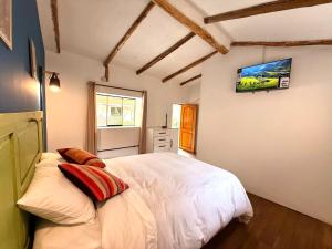 Letto o letti in una camera di Anido Hotel
