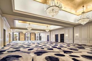 an empty ballroom with a large room with chandeliers at JW Marriott New Orleans in New Orleans +78 photos