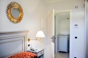 Postel nebo postele na pokoji v ubytování Alessi Hotel Trattoria
