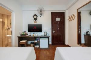 Postel nebo postele na pokoji v ubytování A25 Hotel - Đội Cấn 2