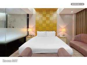 Ένα ή περισσότερα κρεβάτια σε δωμάτιο στο Milan Motel