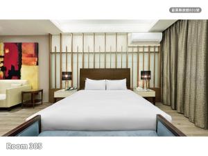 Ένα ή περισσότερα κρεβάτια σε δωμάτιο στο Milan Motel