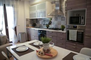 a kitchen with a counter with a table with a plate on it at Giorgia House in Pieta