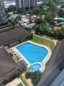 an overhead view of a swimming pool in a city at D&G City Haven in Mandaue City
