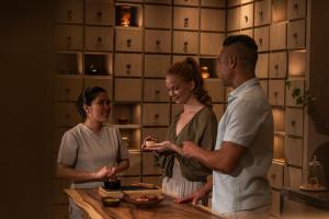 a group of people standing in a kitchen at Anantara Layan Phuket Resort in Layan Beach +206 photos