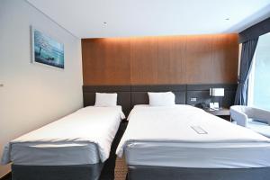 Postel nebo postele na pokoji v ubytování Hotel Susung Spa Resort