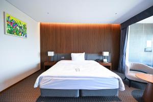 Postel nebo postele na pokoji v ubytování Hotel Susung Spa Resort