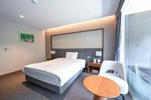 Postel nebo postele na pokoji v ubytování Hotel Susung Spa Resort