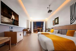 Postel nebo postele na pokoji v ubytování Anyuechengxiang Hotel + 5 fotografií
