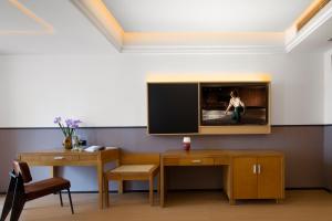 TV a/nebo společenská místnost v ubytování Anyuechengxiang Hotel