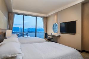 Postel nebo postele na pokoji v ubytování Sheraton Nha Trang Hotel & Spa