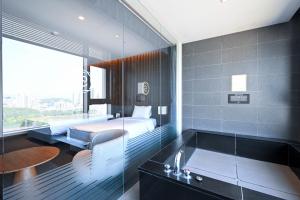 Postel nebo postele na pokoji v ubytování Hotel Susung Spa Resort