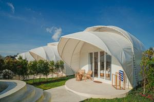 a round house with a domed roof in a yard at Onion Hill Glamping by Manara in Kintamani +20 photos