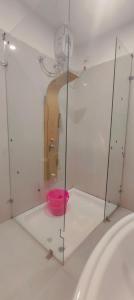 a room with a pink bowl in a glass case at Cilantro Agonda in Agonda