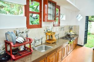 a kitchen with a sink and a counter at Ocean Bliss Villa Mirissa in Kamburugamuwa