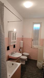 a bathroom with a sink and a toilet at B&B Petit déjeuner in Chiavari +42 photos