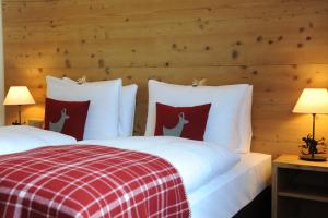 Кровать или кровати в номере Kitzhof Mountain Design Resort
