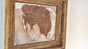 a painting of a woman with long hair at Allegra House - 50mq ultimo piano Milano M1 Villa San Giovanni in Milan +31 photos
