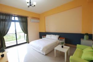 Postel nebo postele na pokoji v ubytování This Home B&B + 6 fotografií