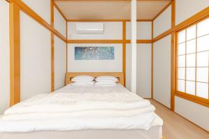 Fukurou House房間的床
