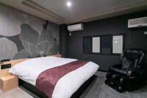 Postel nebo postele na pokoji v ubytování Hotel TEMARI Matsumoto