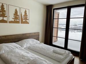 Postel nebo postele na pokoji v ubytování Apartmány nad Anenským potokem - Říčky