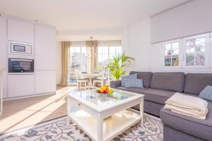 a living room with a couch and a table at Vacances Felanitx in Felanitx