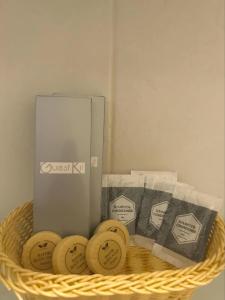 a wicker basket with a box of arousal k packets at Casa Bahia Dive Resort in Bagalañgit