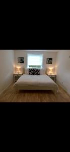 Ένα ή περισσότερα κρεβάτια σε δωμάτιο στο Modern & Spacious apartment +2 φωτογραφίες