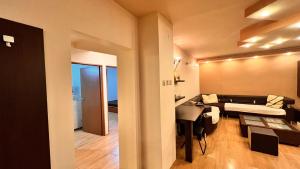 Ένα ή περισσότερα κρεβάτια σε δωμάτιο στο City Central Apartment - Craiova