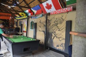 a man playing a game of pool in a store at Lusaka Backpackers in Lusaka