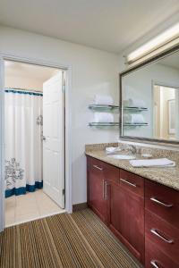 a bathroom with a sink and a mirror at Residence Inn Youngstown Boardman/Poland in Poland
