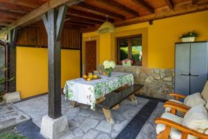a table in a room with a yellow wall at Appto Turístico La Franca LFRA002R in La Franca