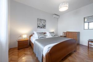 Postel nebo postele na pokoji v ubytování Antares Apartments