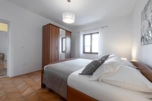 Postel nebo postele na pokoji v ubytování Antares Apartments